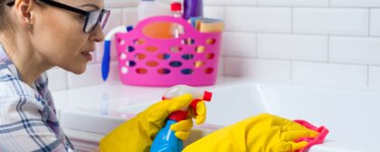 Woman cleaning a surface at home.