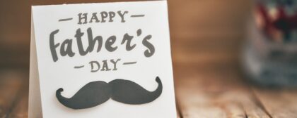 Happy father's day! Postcard on background of wooden table.