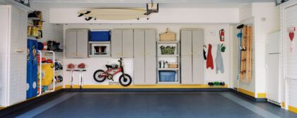 Surfboards and bicycles in empty, clean and organised garage