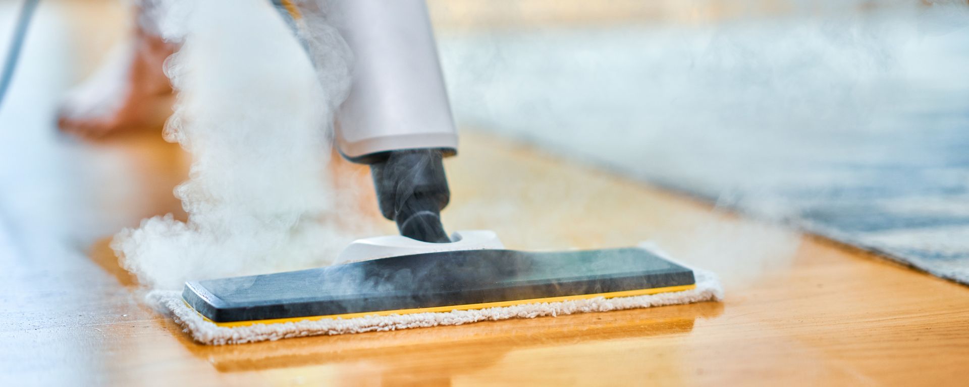 Picture of steam cleaner over floor.