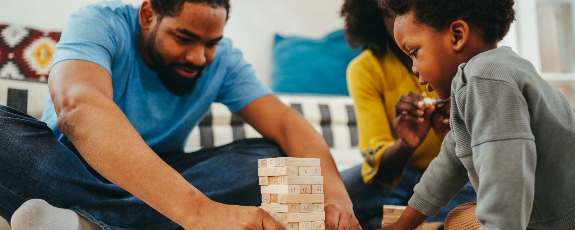 Family having fun while playing Jenga together