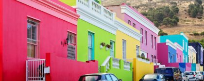 Bright colorful buildings on the street in the historical Bo-Kaap or Malay Quarter district of Cape Town, South Africa.