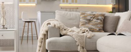 Cosy lounge setting with a couch and blanket in a home